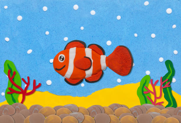 istock orange and white clown fish made from plasticine on under water background 1498122755