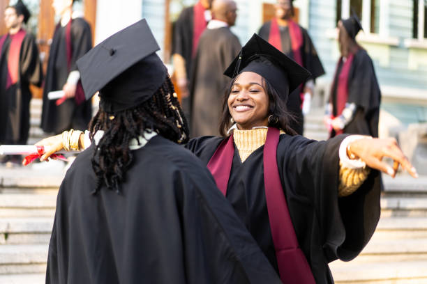 istock Two female graduates embracin on the university steps 1498125214