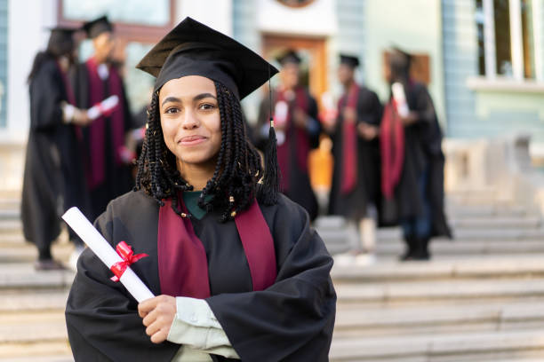 istock A smiling student is happy to receive her diploma 1498125226