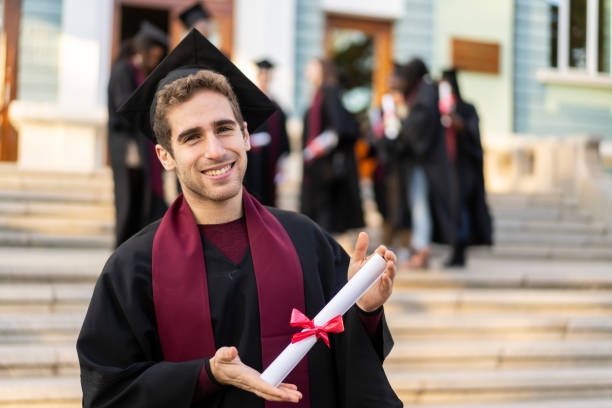 istock An graduate holding his degree 1498125234