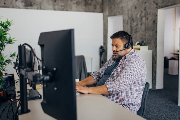 istock Business man, IT expert and support makes a phone call with a client 1498126485