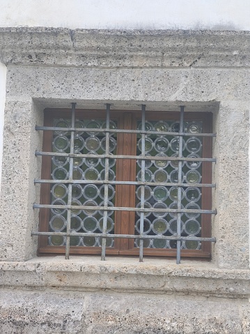 Window in the facade in the European Alps