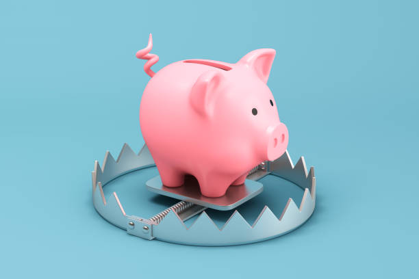 piggy bank on a metallic trap - confinamento imagens e fotografias de stock
