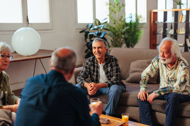 istock Senior people gathering and talking. 1498129239