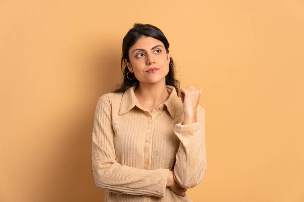 istock serious woman thinking and looking to the side 1498129970