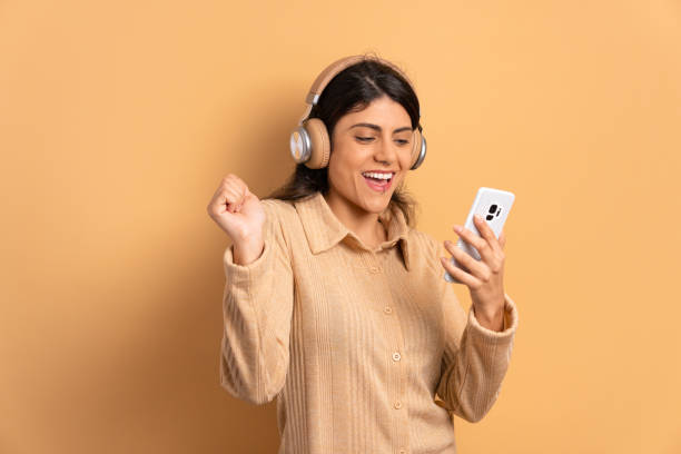 istock woman looking at mobile cell phone screen 1498130514