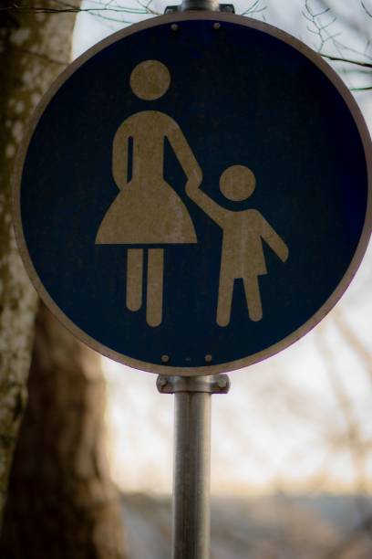 istock Mother Child Crossing Sign Germany 1498131117