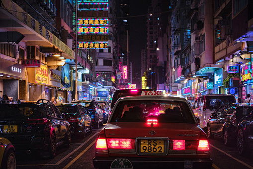 Mong Kok Hong Kong A Traditional Red Taxi And Colorful Neon Light Signs