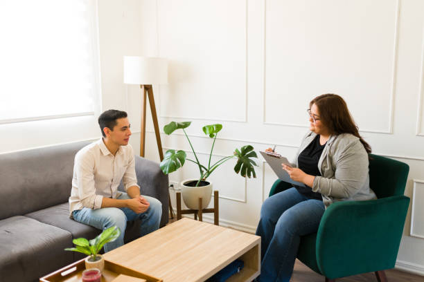 istock Therapist with a young man doing a patient evaluation 1498131754