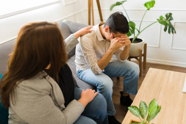 istock Sad depressed patient suffering from depression talking with a psychologist 1498132044