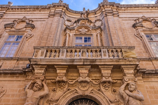 A stunning grand entrance to a majestic stone building in Mdina Old City Fortress