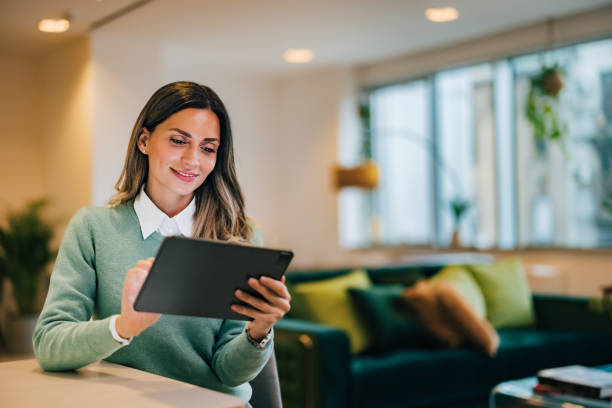 istock Successful businesswoman looking for information on the internet, using a digital tablet at the home office. 1498135033