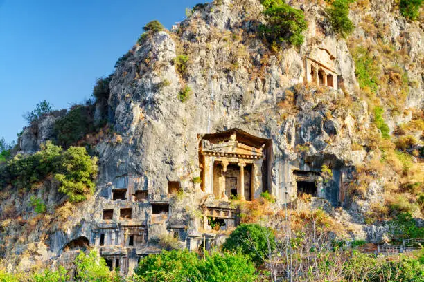 View of the Tomb of Amyntas in Fethiye, Turkey. The Lycian Rock Tombs at ancient Telmessos currently in Fethiye is a popular tourist attraction in Turkey.