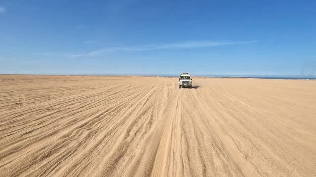 Safari Jeep Driving Through The Desert In Egypt