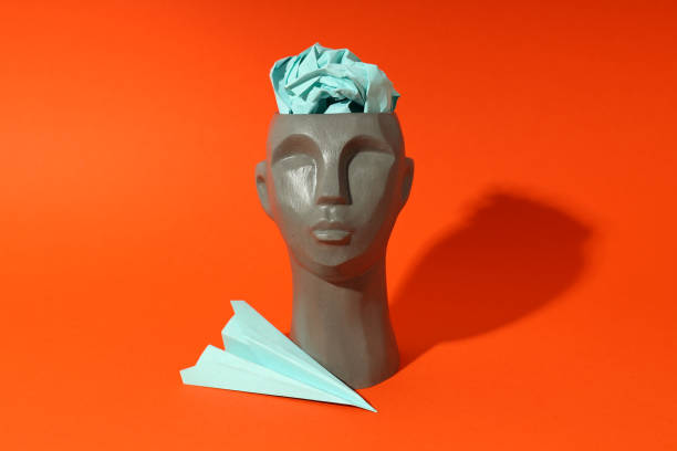 istock Concept of problems with memory, amnesia disease on orange background 1498140490