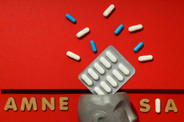 istock Concept of problems with memory, amnesia disease on red background 1498140984