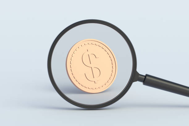 istock Dollar coin behind magnifying glass. 3d render 1498141528