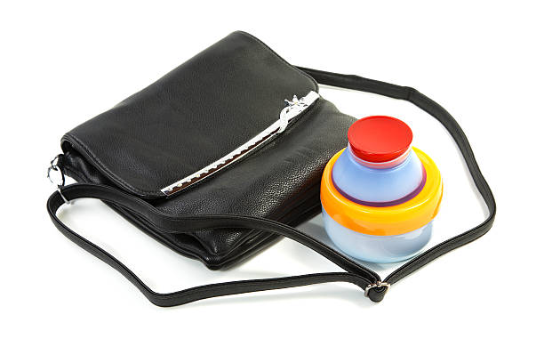istock Female bag and cosmetics isolated on a white 149814166
