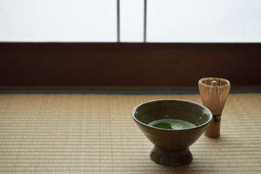 apanese traditional matcha tea on tatami background