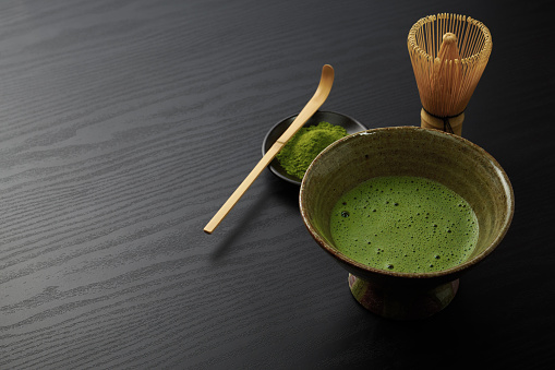 Japanese traditional matcha tea on wood background
