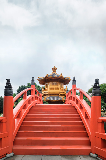 Hong Kong - April 2023: Orange wooden bridge and Golden pavilion of absolute perfection in 