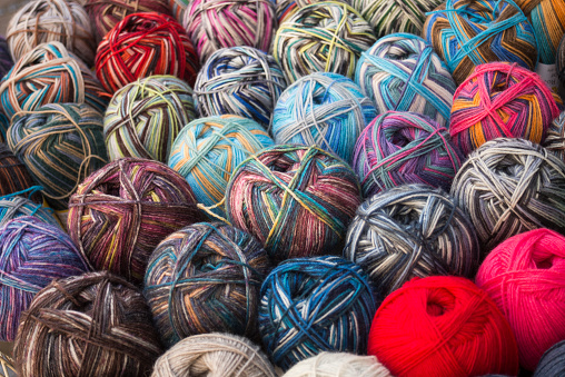 closeup of colorful woolen balls at the market