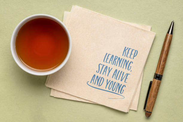 istock keep learning, stay alive and young - inspirational note on a napkin, aging, healthy lifestyle and personal development concept 1498153995