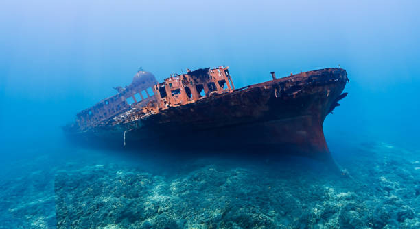 istock destroyed ship under the deep sea on the dirty sand by day 1498154183