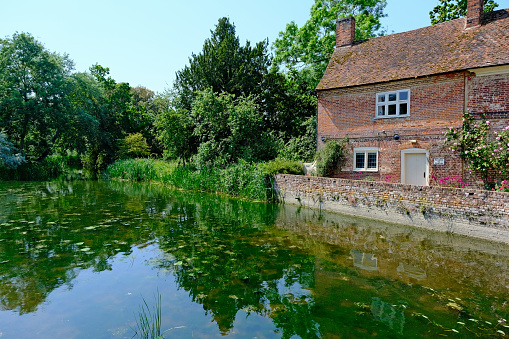 Flatford, Suffolk, United Kingdom, June 10, 2023. Flatford Mill home of English landscape painter John Constable. River Stour valley footpath in Dedham vale. Sunny summer day outdoors