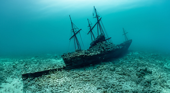 amazing rusty ship sunk in the middle of the sea with good day lighting in the pacific sea