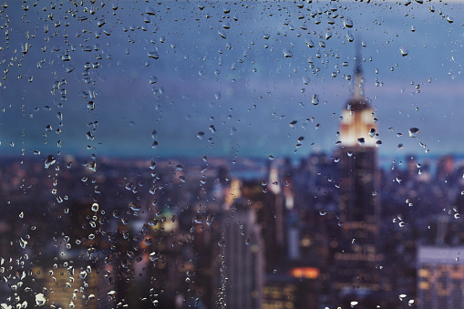 Raindrops on a window looking over New York City