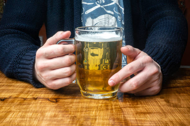 istock a mug filled with beer in your hands 1498159825