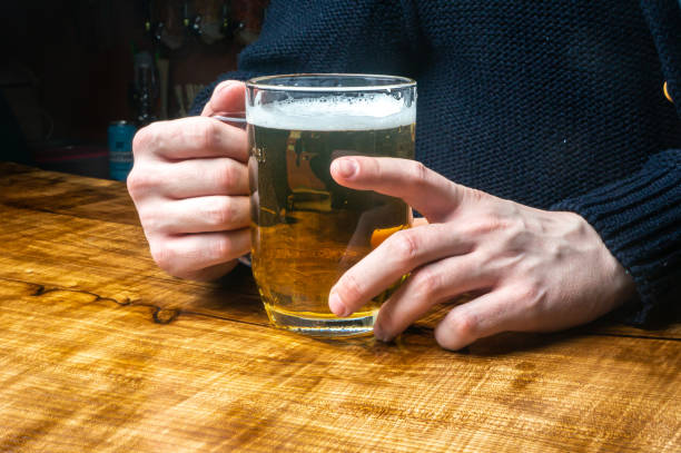 istock a mug filled with beer in your hands 1498159909