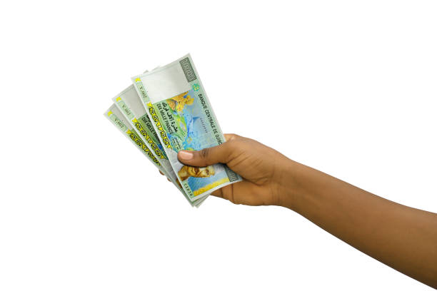 istock Fair hand holding 3D rendered Djiboutian franc notes isolated on white background 1498160050