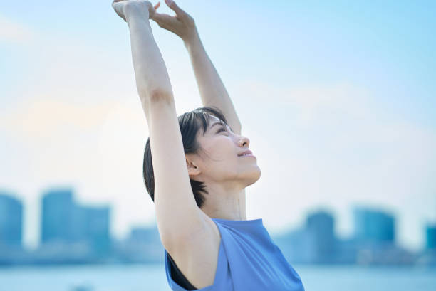 istock A woman with a relaxed expression under the blue sky 1498160084