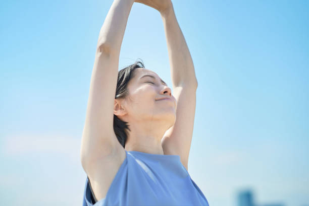 istock A woman with a relaxed expression under the blue sky 1498160238