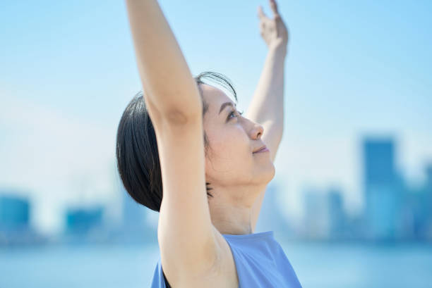 istock A woman with a relaxed expression under the blue sky 1498160286