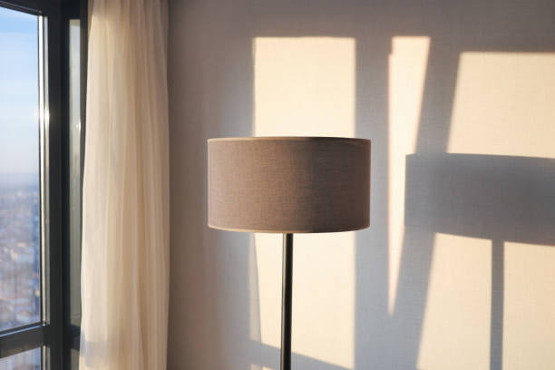 istock a lamp in home against white wall 1498160290