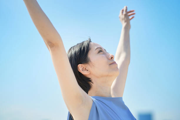 istock A woman with a relaxed expression under the blue sky 1498160381