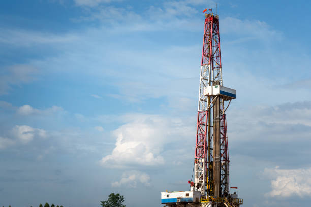 istock Oil drilling rig derrick on blue sky background. 1498162178