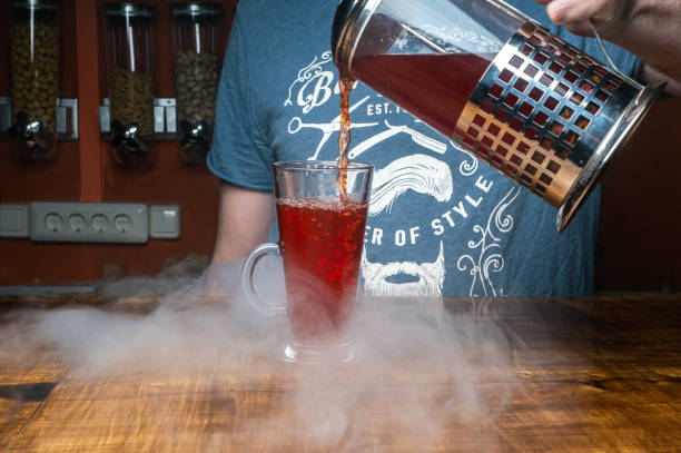 istock a hand pours berry juice into a glass 1498162194
