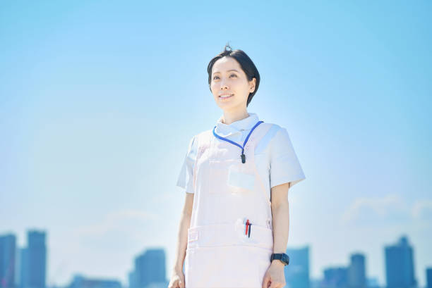 istock woman wearing white coat and apron 1498164434
