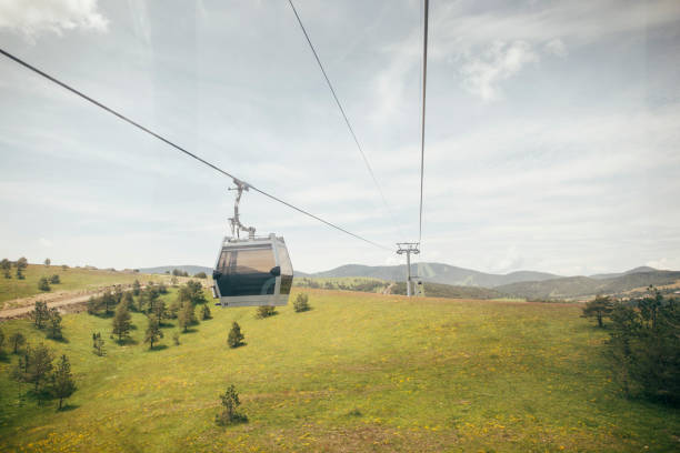 Mountain cable car: a captivating aerial view of Zlatibor mountain, Serbia from another gondola cabin.