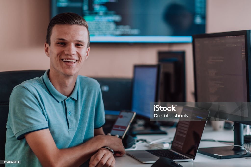 Smartphone Programmer A Programmer Diligently Testing Smartphone Applications While Sitting ...