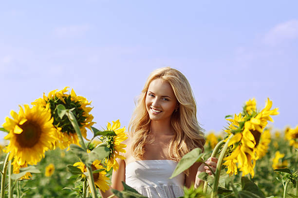 istock young beautiful woman on field in summer 149816897