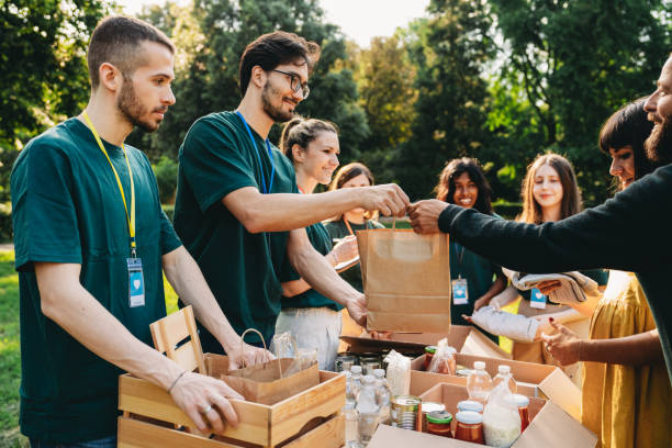 A couple is taking a bag of food at the food and clothes bank stock photo