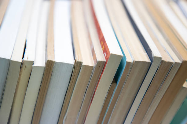 istock stack of books on self. abstract background with books edge. copy space for text. 1498171588