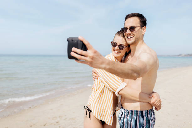 istock Couple taking a polaroid picture 1498172557