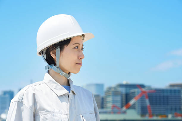 istock A woman wearing a helmet and wearing work clothes 1498174669