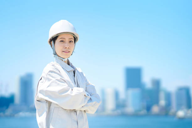 istock A woman wearing a helmet and wearing work clothes 1498174786